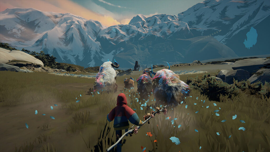 Herdling: A view of the herd running with the mountains in the background