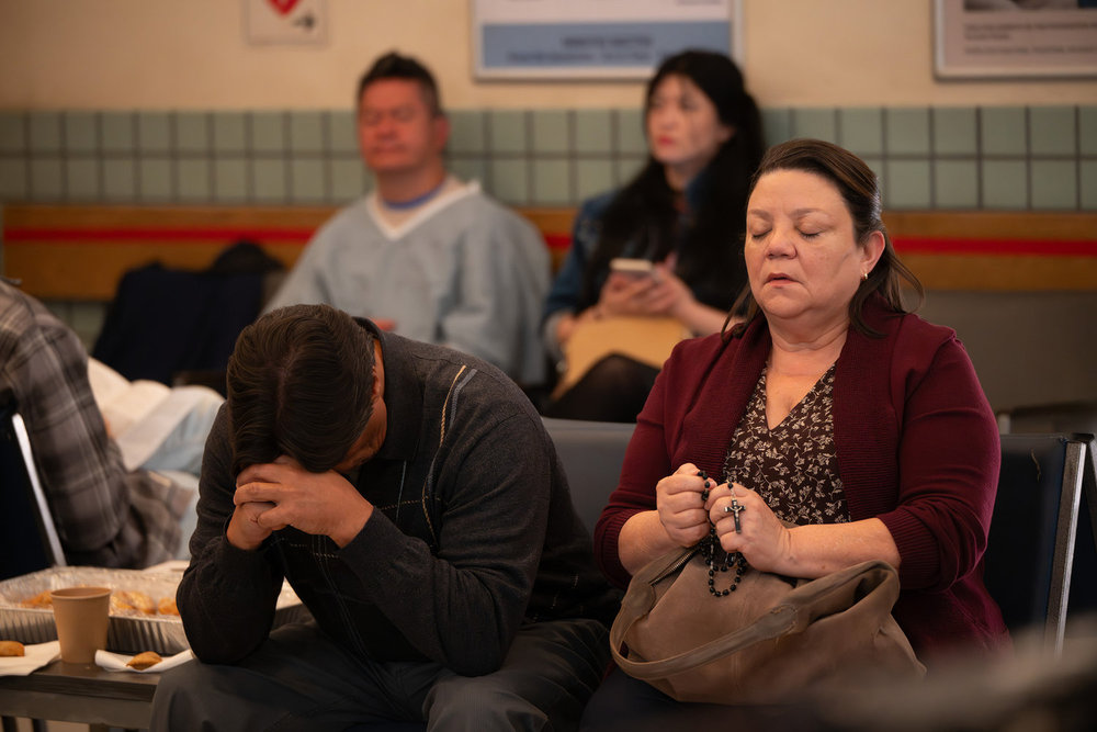 Brilliant Minds - Ana Torres sitting in the waiting room of the hospital, praying