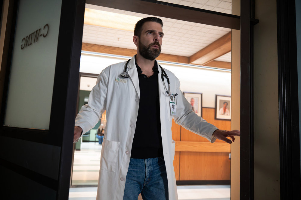 Brilliant Minds - Oliver is entering a room, a confused look on his face