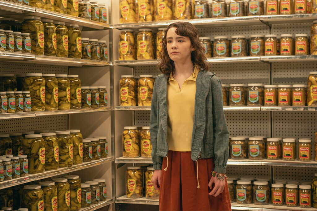 It: Welcome to Derry - Lilly surrounded by pickle jars at the local grocery